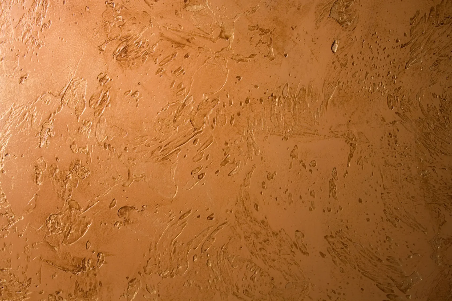 Textured brown plastered wall surface.