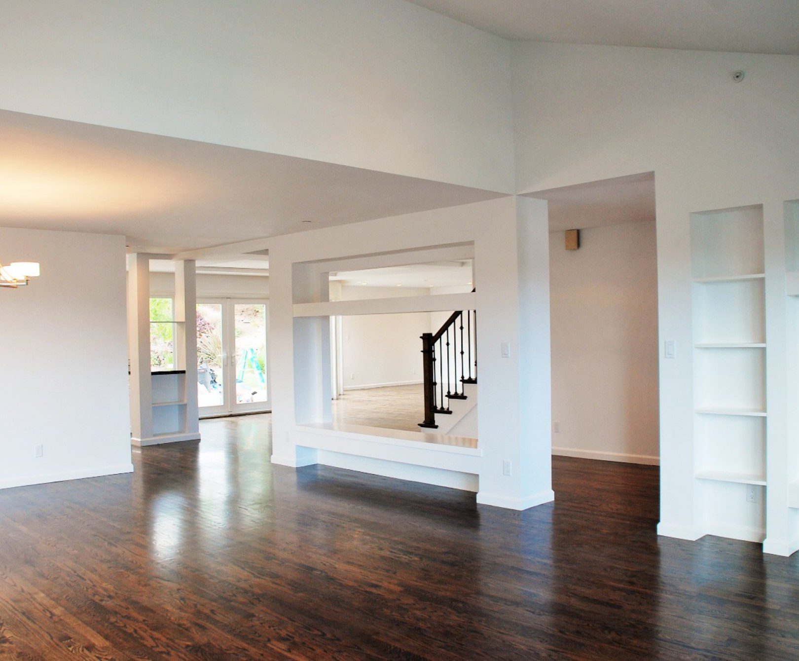 Open-concept room with dark wooden floors.