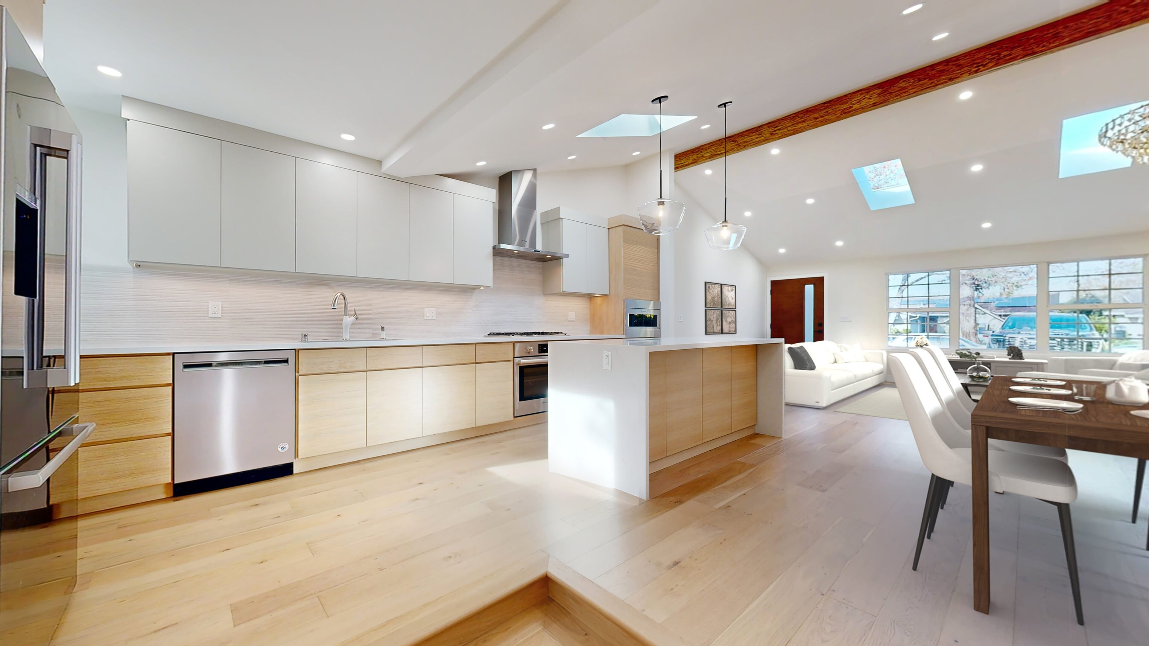 Bright modern kitchen with ample natural light and wooden accents.