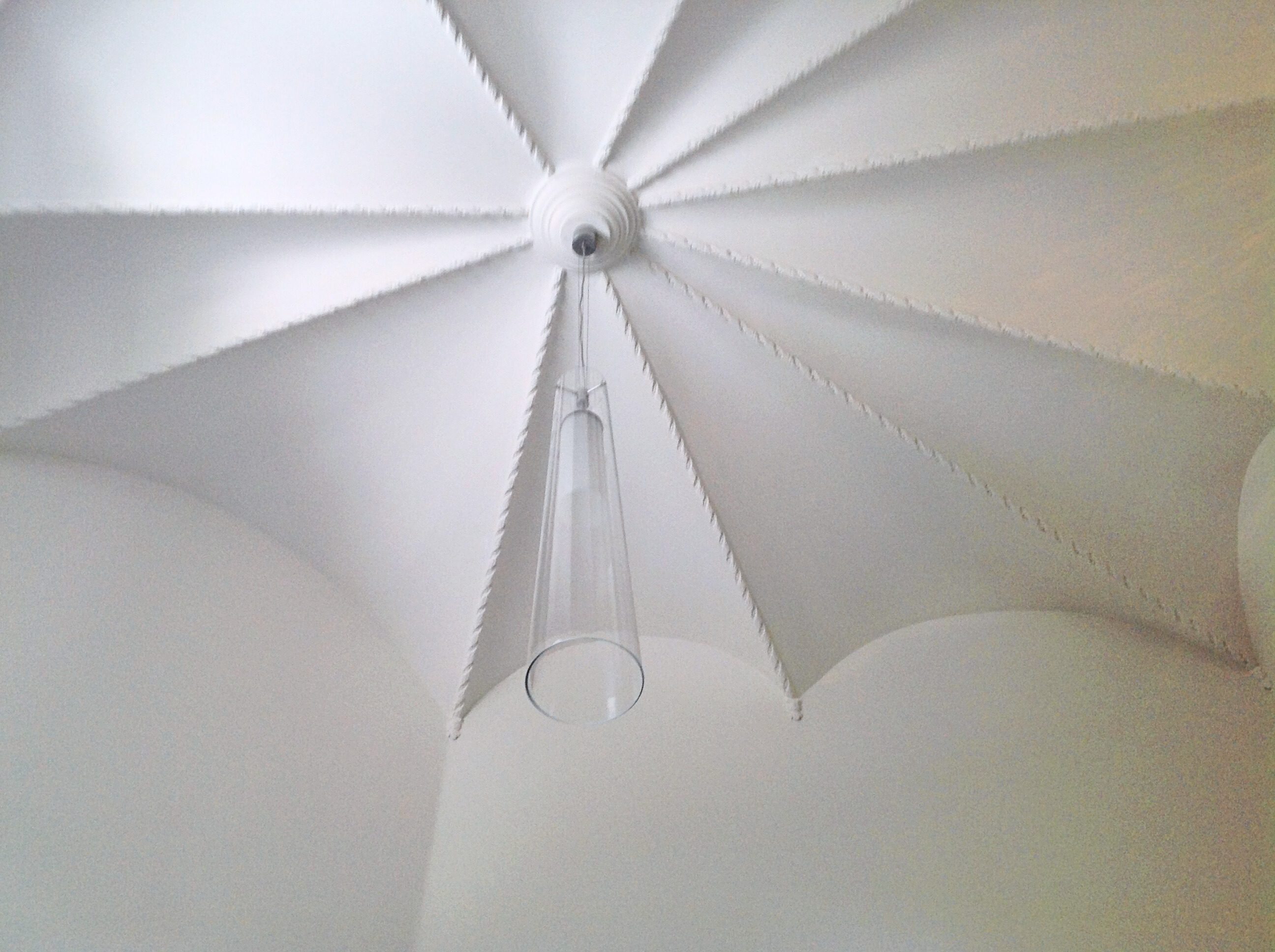 Minimalist modern ceiling light fixture with geometric shapes.