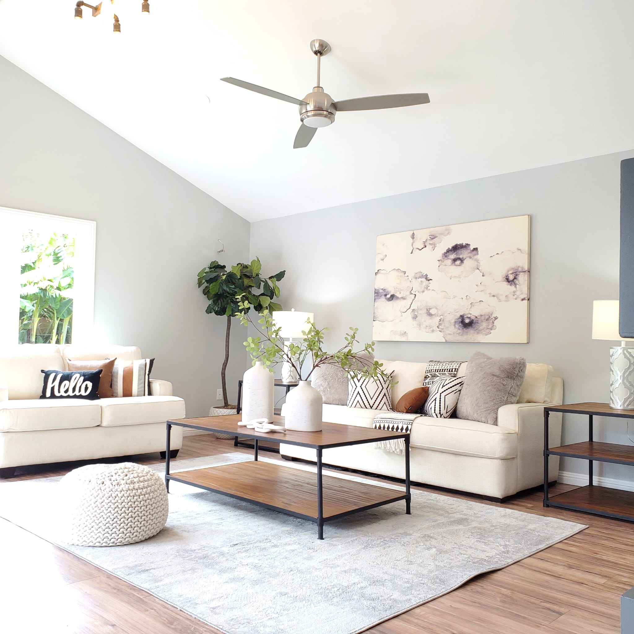 Bright, modern living room with neutral tones and cozy seating.